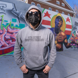 Man wearing 14th Street Graffiti Museum Hooded Sweatshirt